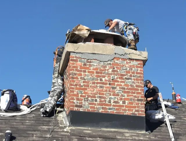 Powell Chimney Sweep installing a custom chimney crown in Powell, OH