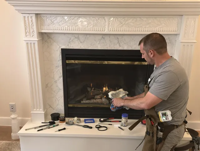 Powell Chimney Sweep performing fireplace maintenance in Powell, OH