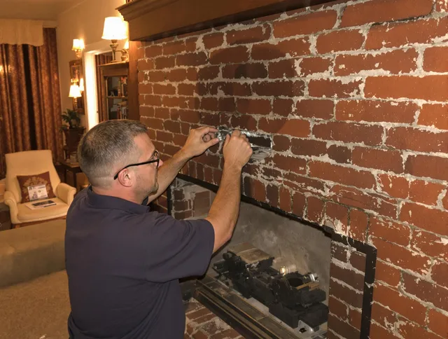 Powell Chimney Sweep expert fixing a fireplace in Powell, OH